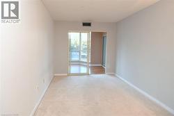 Wall-to-wall carpeting, light neutral wall paint, and sliding glass doors - 
