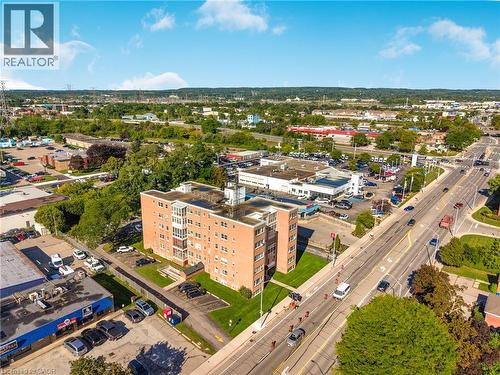 Brick facade multi-story building featuring multiple windows and balcony units - 824 Brant Street Unit# 9, Burlington, ON 