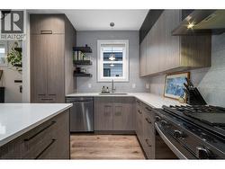 Ceiling height cabinetry provides lots of cupboard space - 