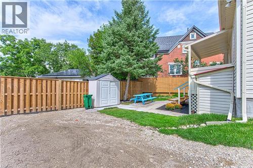 Shared yard with green space and new fence - 217 Lancaster Street E, Kitchener, ON 