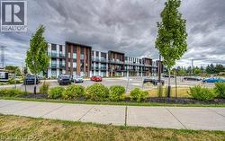 Modern residential building featuring dark paneling and brick-finish accents - 