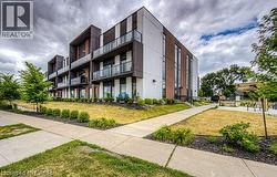 Modern multi-story building with a brick and panel exterior - 