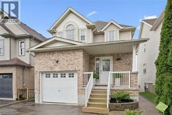 Brick veneer and siding exterior with an attached garage - 