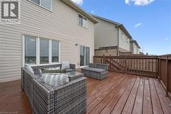 Expansive wood deck with full-height railing and integrated steps - 