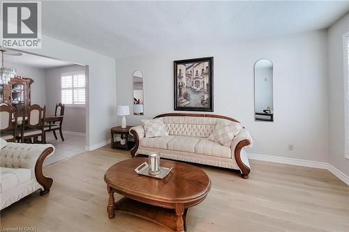 Light wood-finish flooring complements the light wall color - 276 Greencedar Drive, Hamilton, ON 