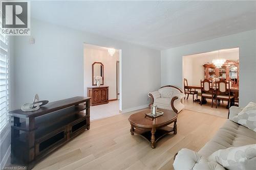 Hardwood-finish flooring, white wall tones, and plantation shutters - 276 Greencedar Drive, Hamilton, ON 