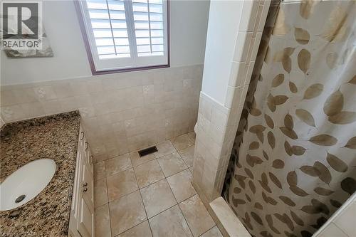 Vanity with granite countertop and integrated sink - 276 Greencedar Drive, Hamilton, ON 