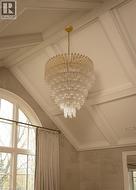 Primary Bedroom with Custom Millwork & Chandelier - 