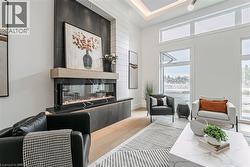 Linear fireplace with wood-finish mantel and stone surround - 