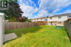 Back of the house with patio and retractable awning - 