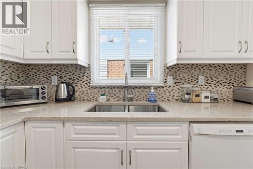 Stainless steel under mount sink, over the sink window bringing in tons of natural light. - 42 Buchanan Crescent, Brantford, ON 