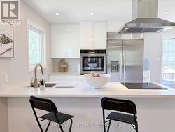 Quartz breakfast bar, stainless appliances - 