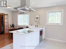 Working island w/ ample natural light from windows - 