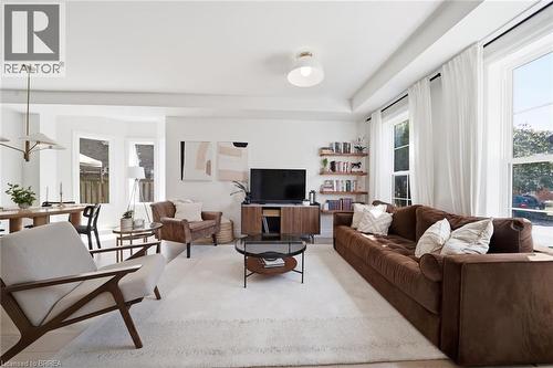 Light-toned flooring, white walls, recessed ceiling, built-in shelving, and large windows - 57 Terrace Hill Street, Brantford, ON 