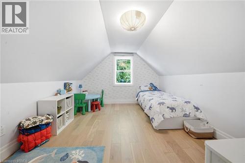 Vaulted ceiling, recessed window, light wood-finish flooring, overhead spherical light fixture, white wall finishes - 57 Terrace Hill Street, Brantford, ON 