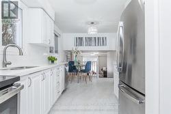 An eat-in kitchen perfect for casual family meals. - 