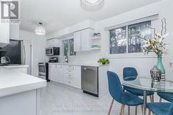 Natural light fills the eat-in kitchen. - 