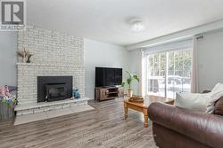 Cozy up by the fireplace on cooler evenings. - 