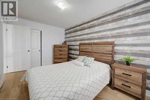 Wood-finish flooring present throughout the space - 300 Watervale Crescent, Kitchener, ON 