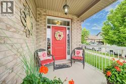 Inviting brick facade with a vibrant red entry door - 