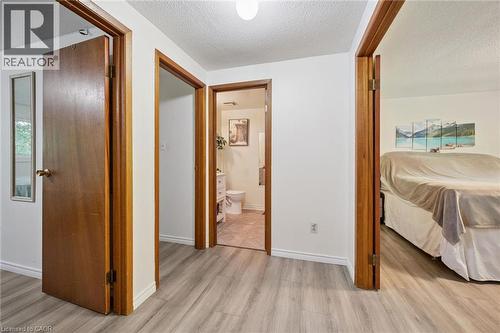 Wood-finish flooring throughout, white painted walls, and wood-trim doorways - 46 Cedarwoods Crescent Unit# 53, Kitchener, ON - Indoor