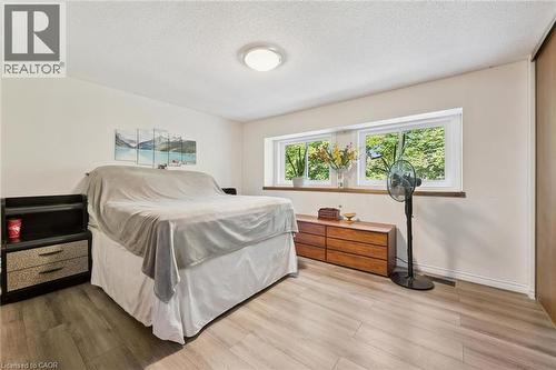 Wood-finish flooring with white walls and a white ceiling - 46 Cedarwoods Crescent Unit# 53, Kitchener, ON - Indoor Photo Showing Bedroom