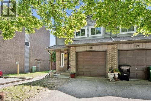 Brick and siding exterior with a covered entry - 46 Cedarwoods Crescent Unit# 53, Kitchener, ON - Outdoor With Exterior
