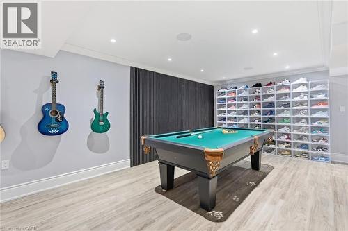 Recessed ceiling lighting, wood-finish flooring, accent wall paneling - 2312 Ridgeview Court, Burlington, ON - Indoor Photo Showing Other Room