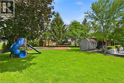 Expansive green lawn with mature trees, a designated sports court, and a unique barrel-shaped structure - 2312 Ridgeview Court, Burlington, ON - Outdoor