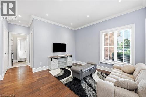 Hardwood flooring, recessed lighting, crown molding, white trim, and a window with blinds - 2312 Ridgeview Court, Burlington, ON - Indoor Photo Showing Living Room