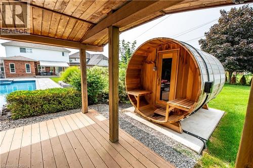 Wood-finish deck with a wood-lined ceiling, barrel sauna, and an in-ground swimming pool - 2312 Ridgeview Court, Burlington, ON - Outdoor With Deck Patio Veranda