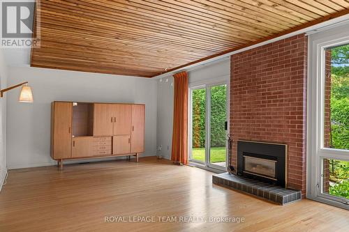 Living room - 1380 Marchand Street, Ottawa, ON - Indoor Photo Showing Living Room With Fireplace