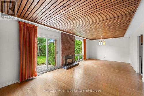 Living room/dining room - 1380 Marchand Street, Ottawa, ON - Indoor With Fireplace