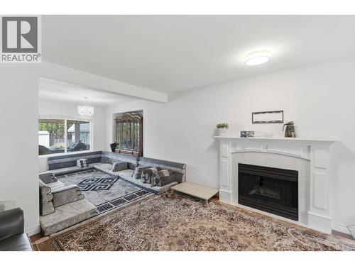 348 Phipps Crescent, Kelowna, BC - Indoor Photo Showing Living Room With Fireplace