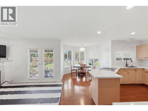348 Phipps Crescent, Kelowna, BC - Indoor Photo Showing Kitchen With Fireplace
