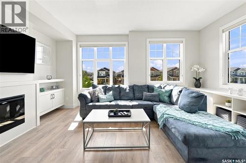 703 Meadows Boulevard, Saskatoon, SK - Indoor Photo Showing Living Room With Fireplace