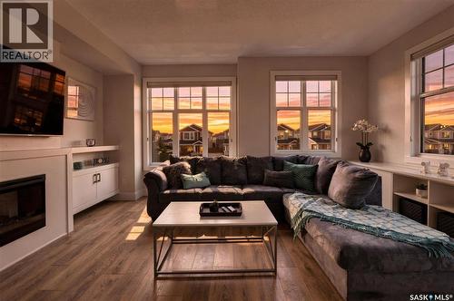 703 Meadows Boulevard, Saskatoon, SK - Indoor Photo Showing Living Room With Fireplace