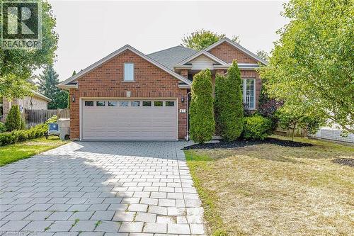 Brick-clad exterior with a prominent attached garage - 47 Queensway Drive, Strathroy, ON - Outdoor