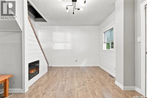 423 E Avenue S, Saskatoon, SK - Indoor Photo Showing Other Room With Fireplace