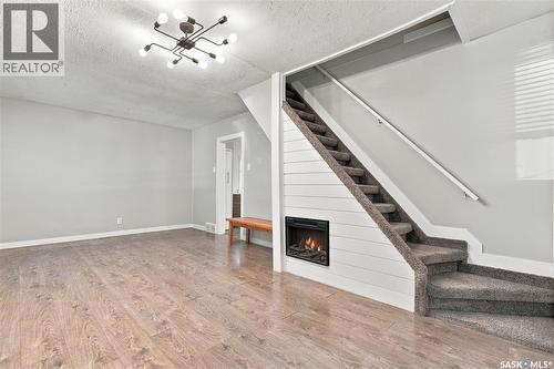 423 E Avenue S, Saskatoon, SK - Indoor Photo Showing Other Room With Fireplace