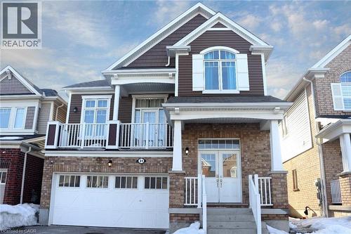 Brick and siding exterior with a prominent two-car garage - 31 Sofitel Drive, Kitchener, ON - Outdoor With Facade