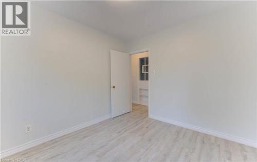Light-toned wood-finish flooring - 50 Gordon Avenue, Kitchener, ON - Indoor Photo Showing Other Room