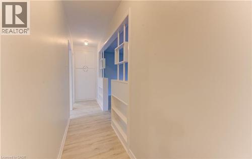 Recessed ceiling lighting illuminating wood-finish flooring - 50 Gordon Avenue, Kitchener, ON - Indoor Photo Showing Other Room
