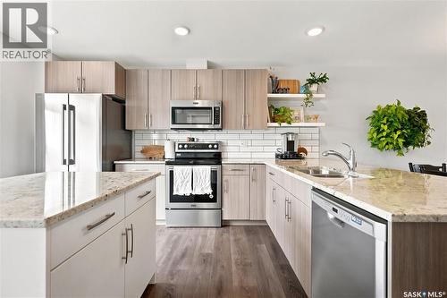 5485 Cade Street E, Regina, SK - Indoor Photo Showing Kitchen With Stainless Steel Kitchen With Double Sink With Upgraded Kitchen
