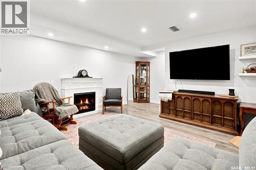 5485 Cade Street E, Regina, SK - Indoor Photo Showing Living Room With Fireplace