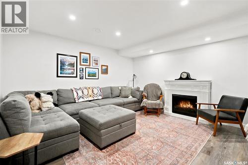 5485 Cade Street E, Regina, SK - Indoor Photo Showing Living Room With Fireplace