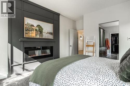 410 Willowgrove Crescent, Saskatoon, SK - Indoor Photo Showing Bedroom With Fireplace
