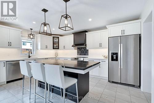 Bright kitchen with plenty of cabinet space. - 48 Ambrosia Path, St. Thomas, ON - Indoor Photo Showing Kitchen With Stainless Steel Kitchen With Upgraded Kitchen