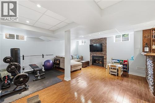 Wood-finish flooring with recessed lighting - 738 Fourth Line, Milton, ON - Indoor With Fireplace