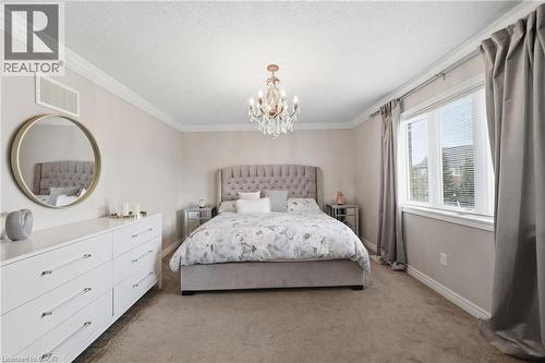 Recessed ceiling lighting, crown molding, and a crystal chandelier - 738 Fourth Line, Milton, ON - Indoor Photo Showing Bedroom